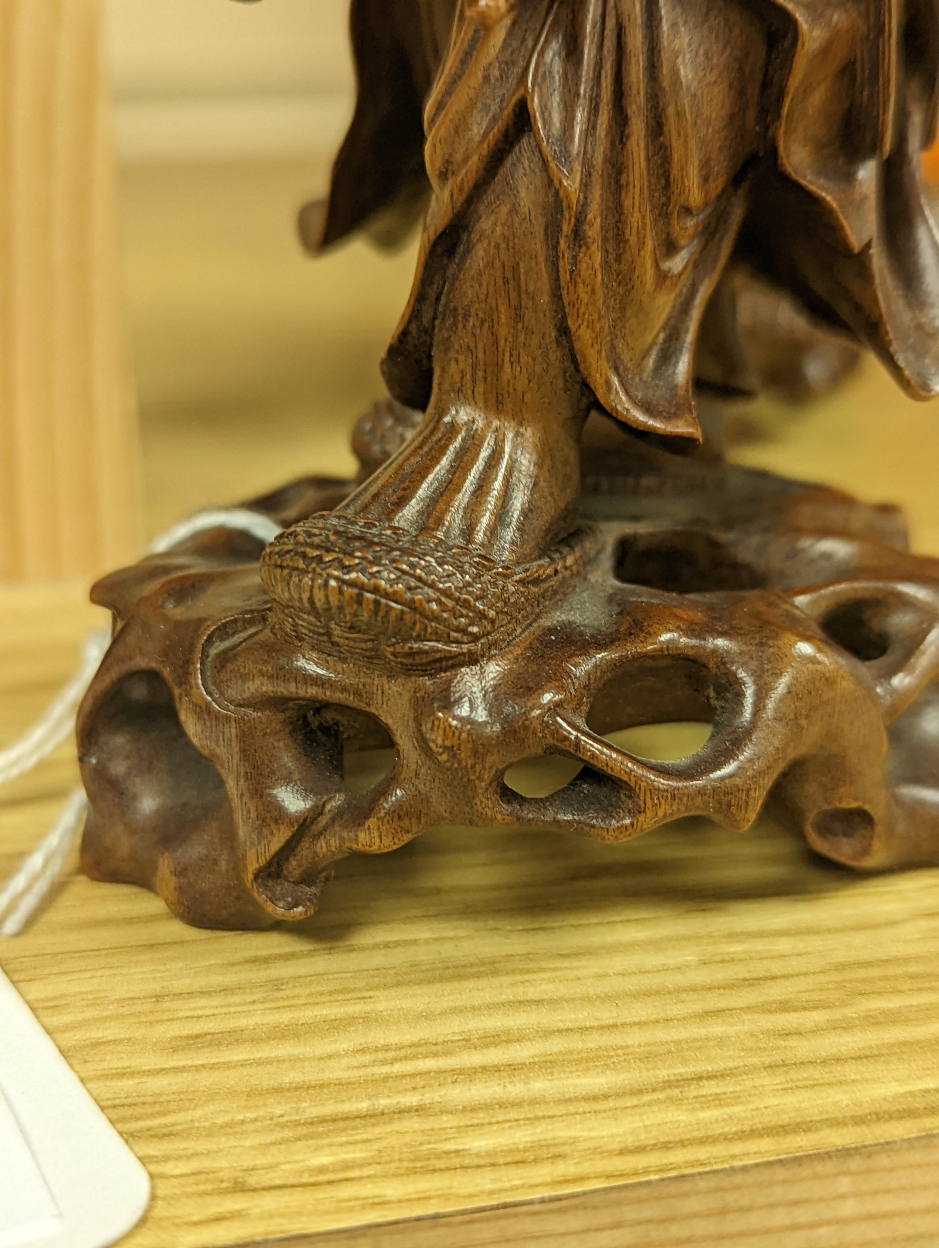 Two Chinese hardwood figures of a fisherman and a old man holding peaches 16cm